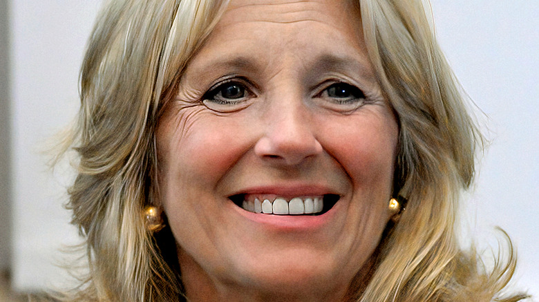 Jill Biden in beige smiling