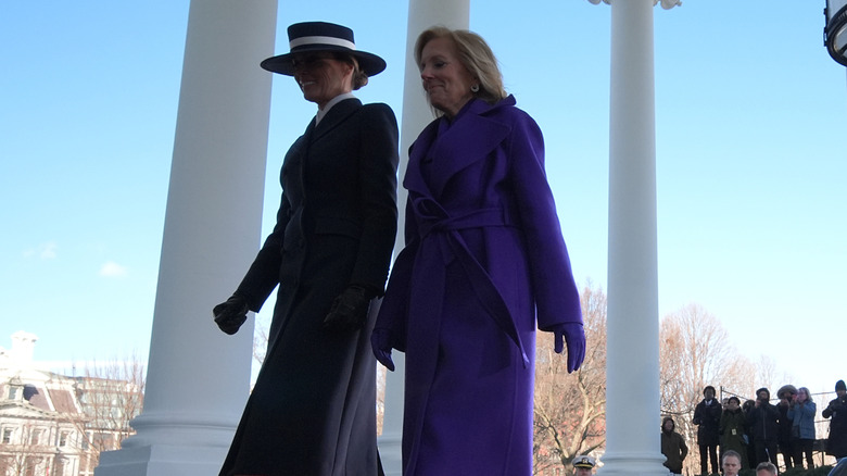 Melania Trump and Jill Biden walk into the White House