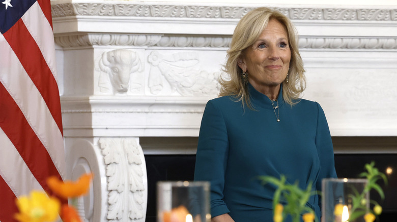 Jill Bidenin front of a mantel