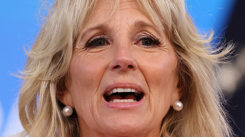 Dr. Jill Biden speaking in pearl earrings