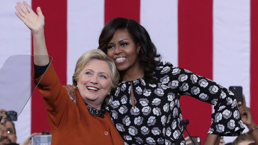 Hillary Clinton and Michelle Obama hugging 