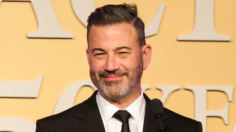 Jimmy Kimmel smiling on the red carpet