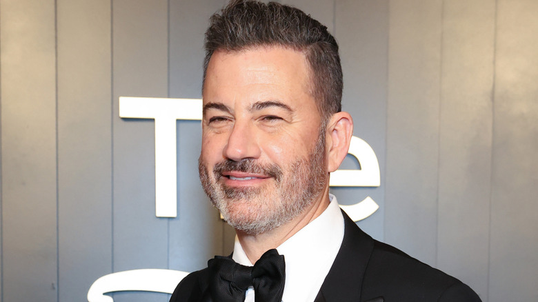 Jimmy Kimmel smiling in a tuxedo at an event