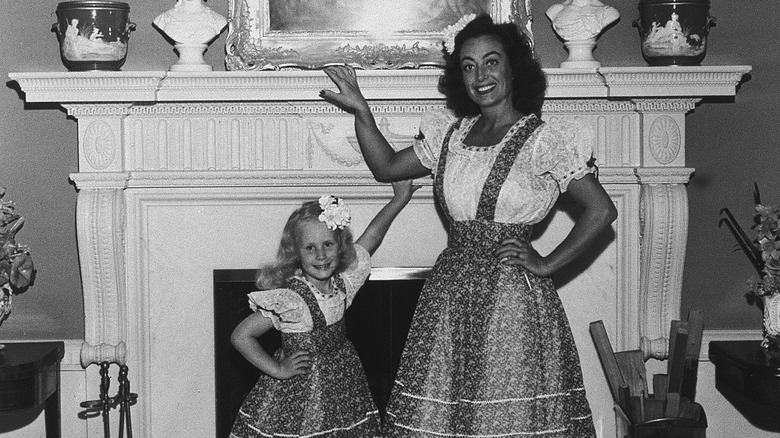 Christina Crawford and Joan Crawford smiling and posing together
