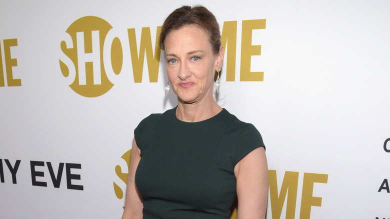 Joan Cusack in a green dress