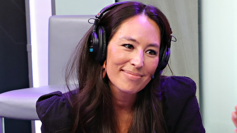 Joanna Gaines wearing headphones for a radio interview