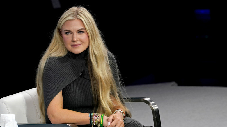 Erika Kirk sitting and looking to the left