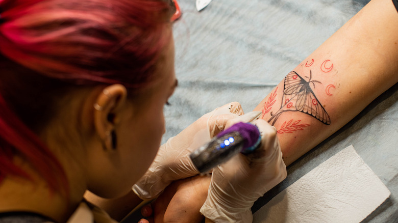 woman with tattoos