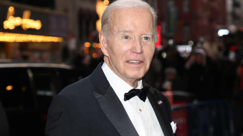 Joe Biden smiling at the camera in a tuxedo