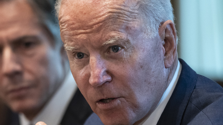 Joe Biden sitting next to Tony Blinken