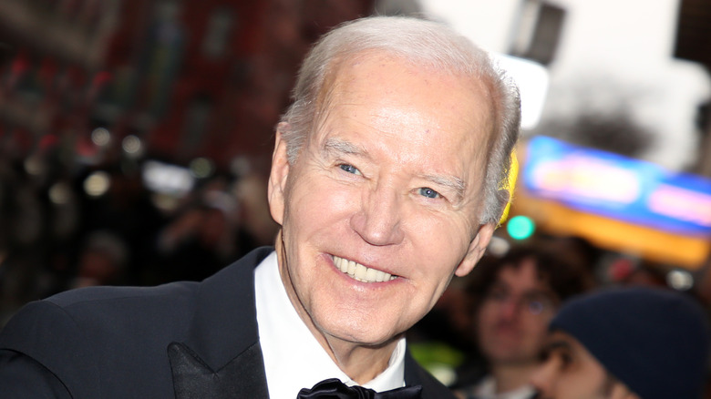 Joe Biden smiling in a suit