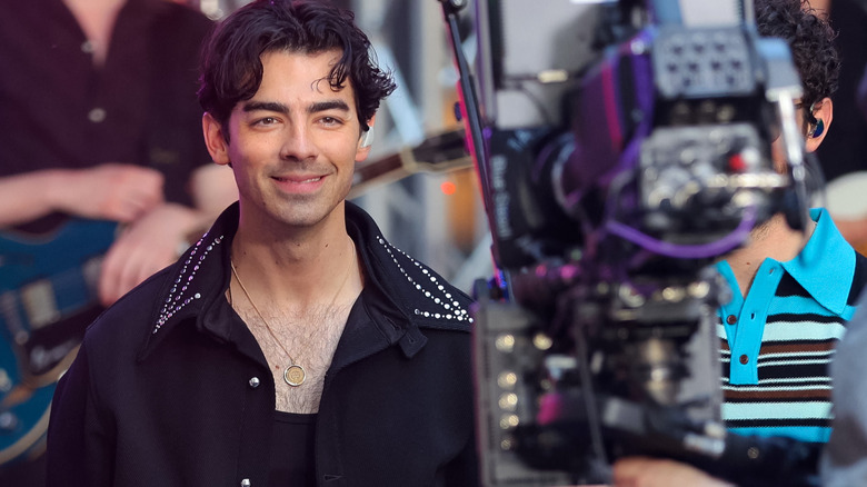 Joe Jonas smiling at camera