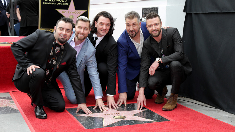 NSYNC touching their Hollywood star
