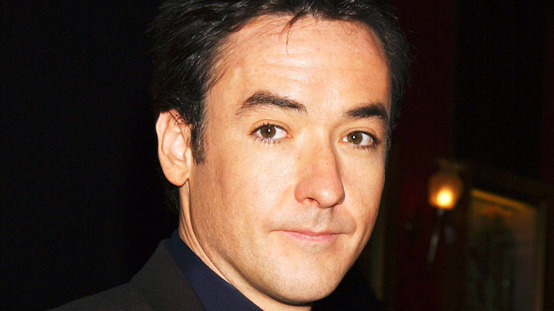 John Cusack looking into the camera