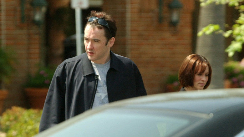 John Cusack and Jennifer Love Hewitt near a car