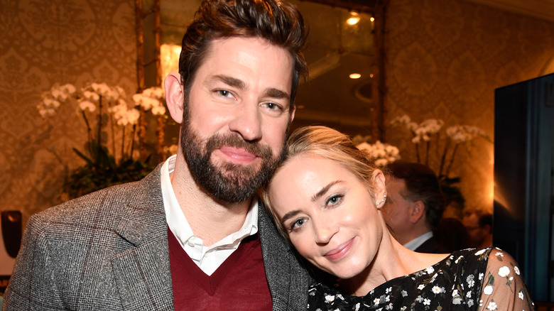Emily Blunt and John Krasinski cuddling up at an event