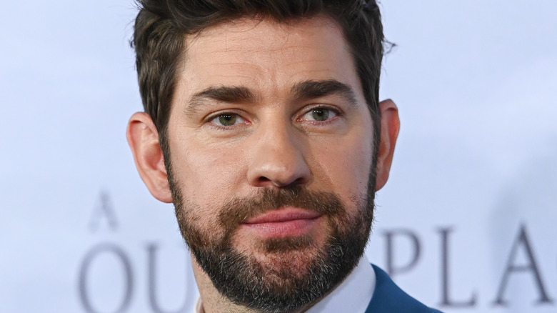 John Krasinski posing on red carpet