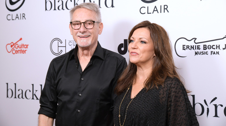 John and Martina Mcbride smiling and posing.
