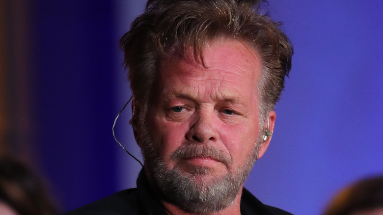 ohn Mellencamp performing on stage