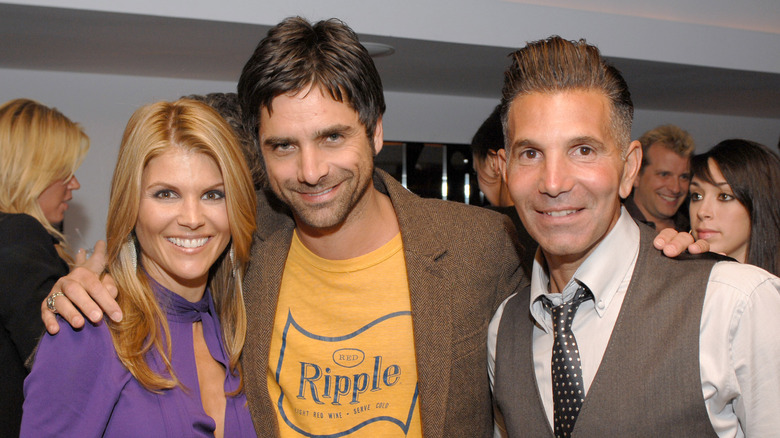John Stamos poses with Lori Loughlin and Mossimo Giannulli