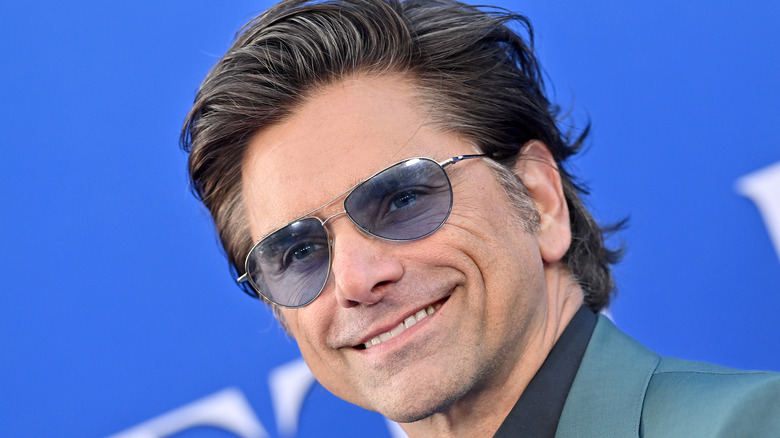 John Stamos wearing sunglasses