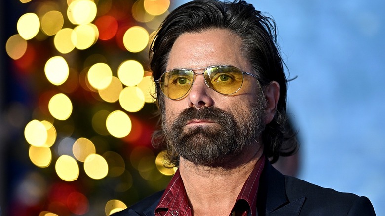 Actor John Stamos wearing sunglasses