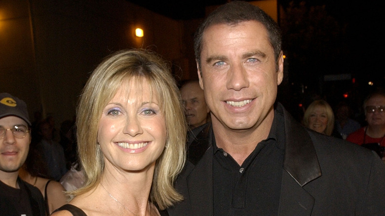 Olivia Newton-John and John Travolta smiling 