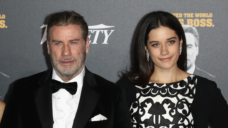 John and Ella Travolta posing on the red carpet.