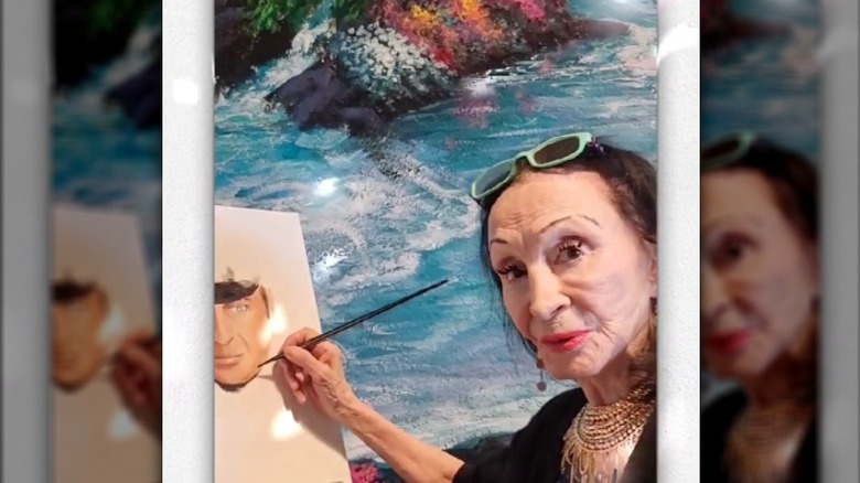 Pilar Pallete Wayne painting a portrait of John Wayne
