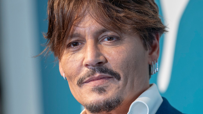 Johnny Depp slightly smiling