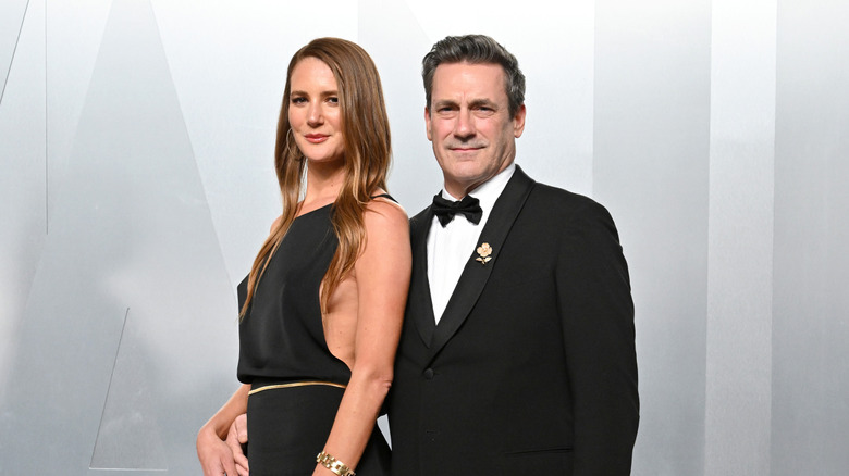 Jon Hamm, right, posing behind Anna Osceola.
