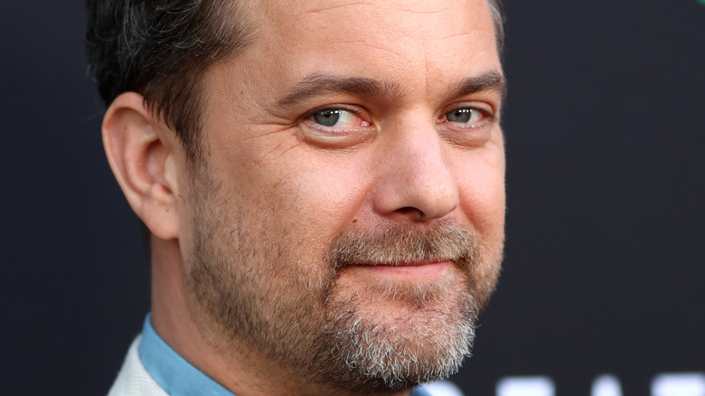Joshua Jackson smiles for the camera on the red carpet.