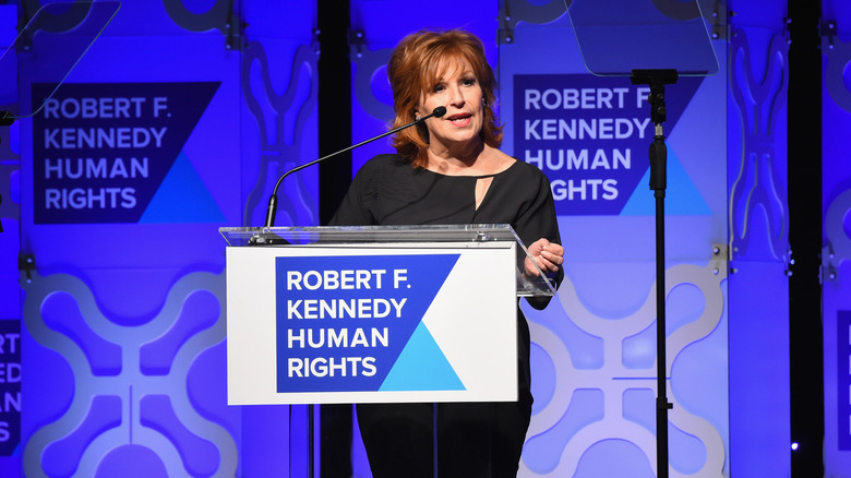 Joy Behar speaking behind the podium on stage at a "Robert F. Kennedy Human Rights" event