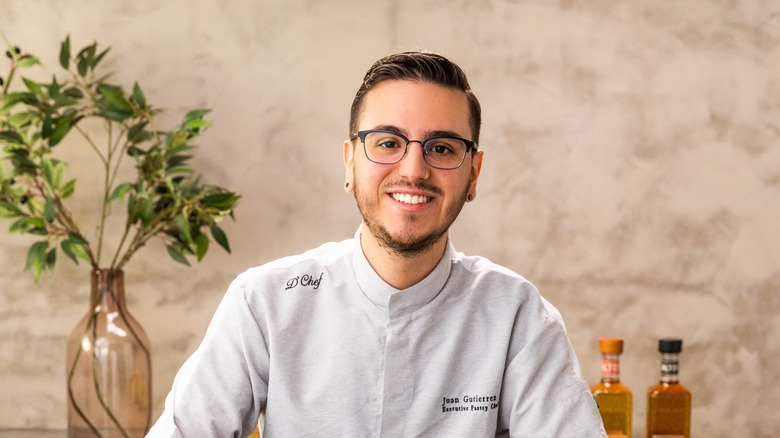 Juan Gutierrez posing with cocktail