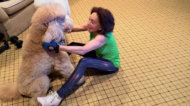 Jeanine Pirro plays with her dog during a home workout (2025)