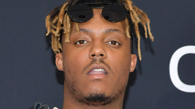 Juice WRLD posing, sunglasses up