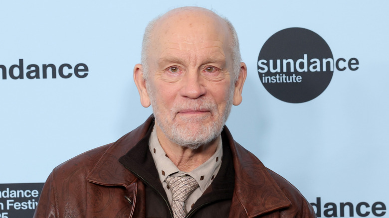 John Malkovich posing at the Sundance Film Festival