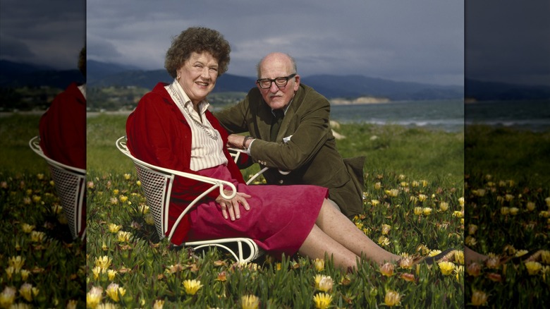 Julia Child and Paul Child sitting together in wildflowers in Santa Barbara, California