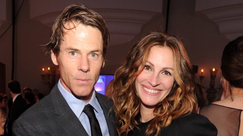 Danny Moder and Julia Roberts posing and smiling together.
