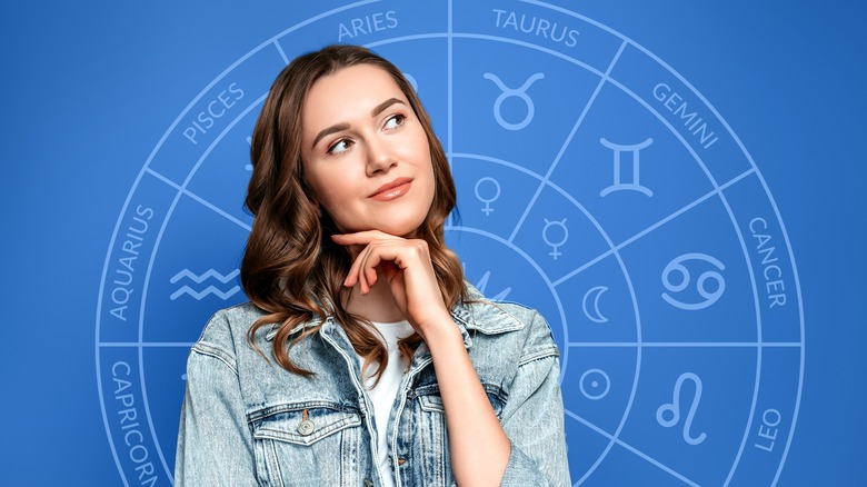 Woman in front of zodiac wheel 