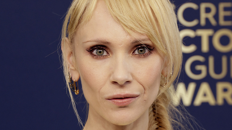 A close-up of Juno Temple with sparkling eye shadow