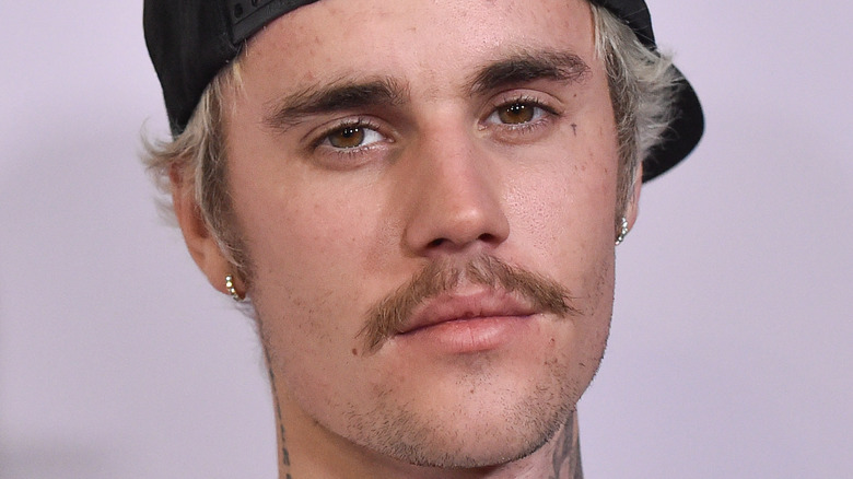 Justin Biebers FACE tattoo finally revealed and its a tribute to wife  Hailey  Irish Mirror Online