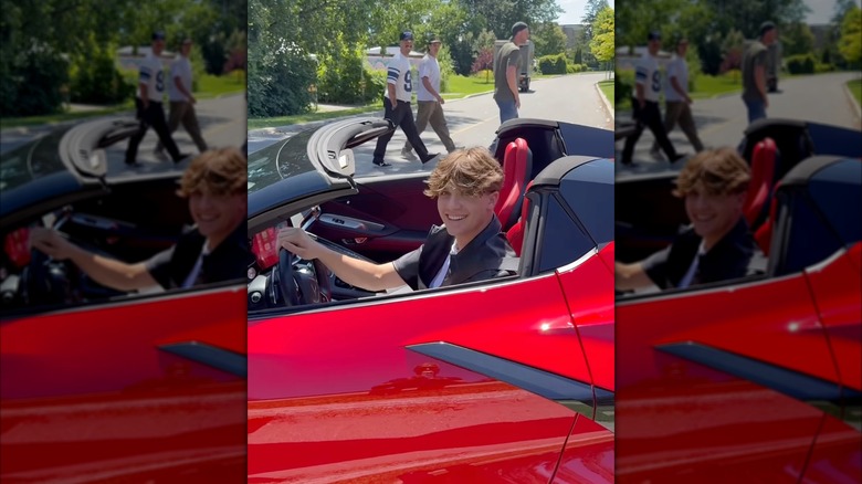 Xavier Trudeau in a red Chevrolet Corvette
