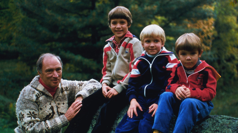 Justin Trudeau posing with his father and brothers in 1980.