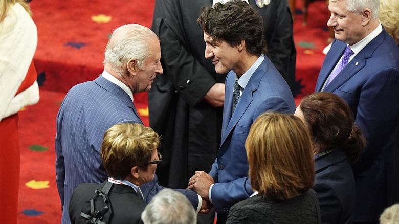 Justin Trudeau speaks with King Charles III at the Speech From the Throne event in May 2025