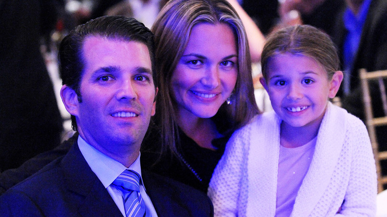 Donald Trump Jr, Vanessa Trump, and a young Kai Trump posing together