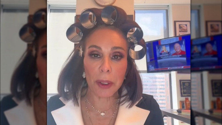 Jeanine Pirro talking to camera while wearing huge rollers in her hair