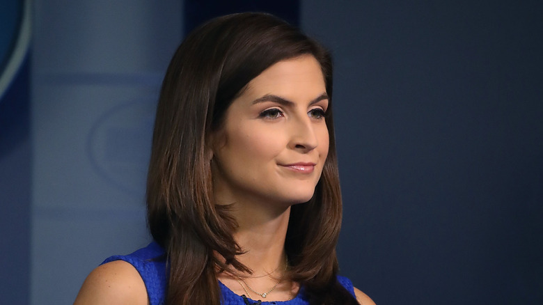 Kaitlan Collins smiling in a blue dress
