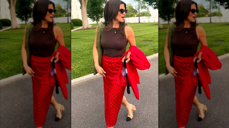 Kaitlan Collins walking in polka dot skirt