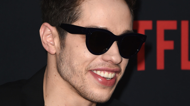 Pete Davidson smiling with sunglasses
